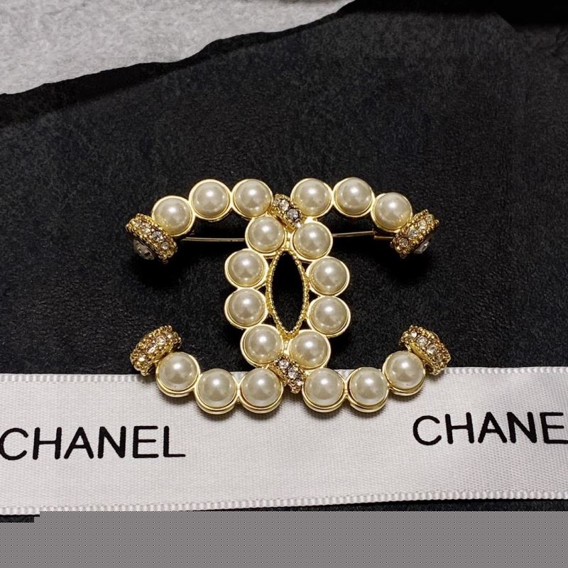 Ch*el brooches